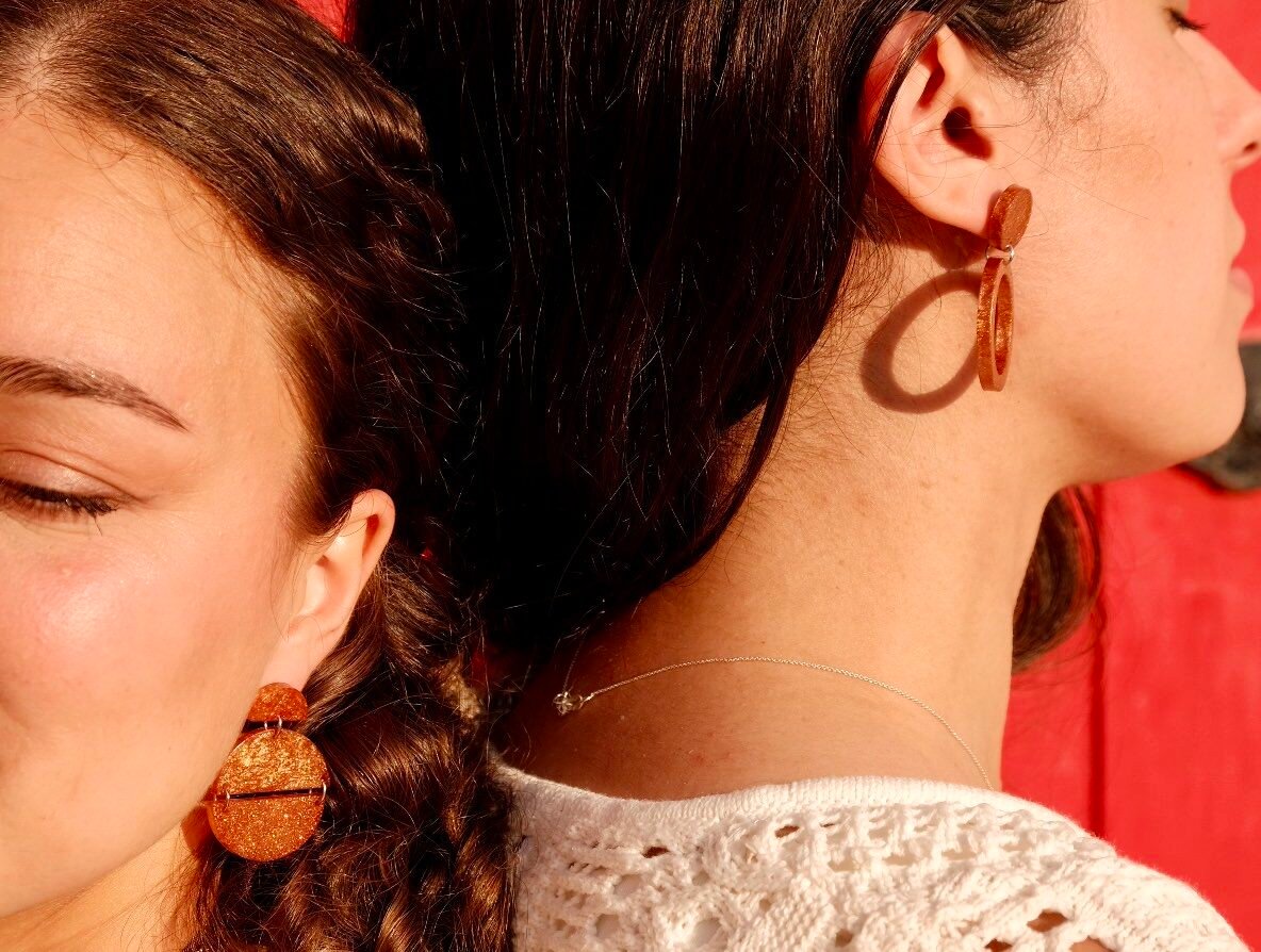 Hibiscus Amarillo earrings from Costa Brava collection, photographed in natural Mediterranean light